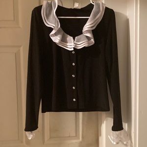 Blouse with sheer ruffled collar and whit ribbon